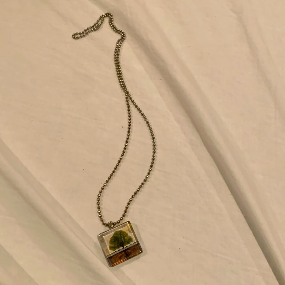EUC dog tag style necklace with pendant picturing a tree